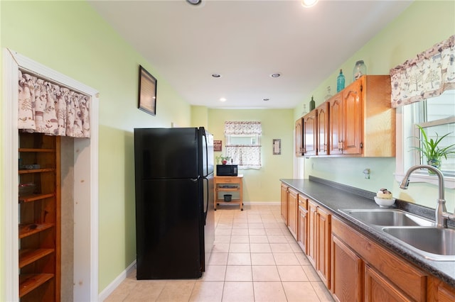 49 Palmer Ave, Warwick, RI 02889 - kitchen with black appliances, dark countertops, light tile patterned floors, brown cabinets, and recessed lighting