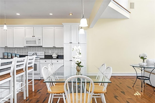 37 Teal Rd, South Kingstown, RI 02879 - dining room featuring dark wood-type flooring and recessed lighting