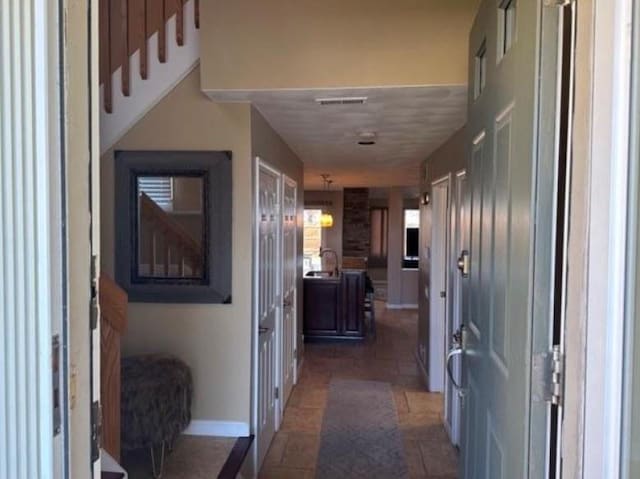 88 Nipmuc Trl Unit C, North Providence, RI 02904 - corridor with baseboards and a sink