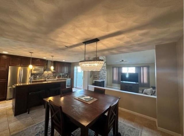 88 Nipmuc Trl Unit C, North Providence, RI 02904 - dining space with healthy amount of natural light, light tile patterned flooring, and ceiling fan