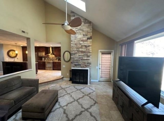88 Nipmuc Trl Unit C, North Providence, RI 02904 - living area with high vaulted ceiling, a ceiling fan, and a stone fireplace