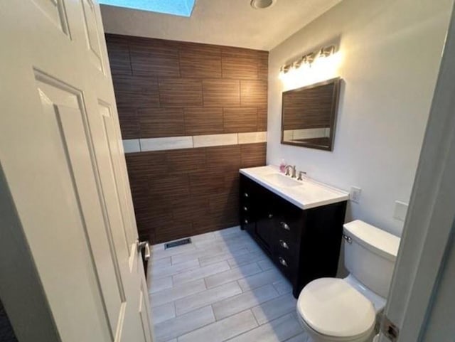 88 Nipmuc Trl Unit C, North Providence, RI 02904 - bathroom with vanity, a skylight, and tile patterned floors