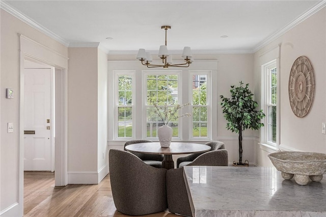 175 Freeman Pkwy, Providence, RI 02906 - dining area with a chandelier, plenty of natural light, light wood-type flooring, and crown molding
