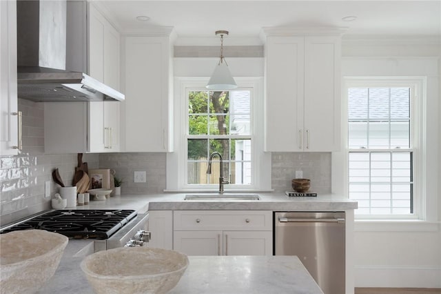 175 Freeman Pkwy, Providence, RI 02906 - kitchen featuring wall chimney exhaust hood, stainless steel dishwasher, white cabinetry, backsplash, and crown molding