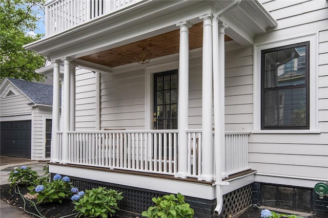 175 Freeman Pkwy, Providence, RI 02906 - view of side of home with covered porch, a garage, and an outdoor structure