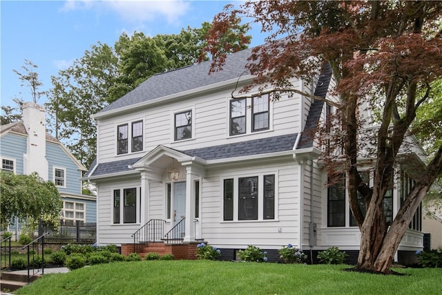 175 Freeman Pkwy, Providence, RI 02906 - view of front of house featuring a front lawn and roof with shingles