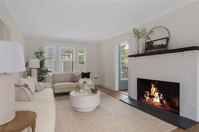 175 Freeman Pkwy, Providence, RI 02906 - living area featuring a brick fireplace, wood finished floors, healthy amount of natural light, and ornamental molding