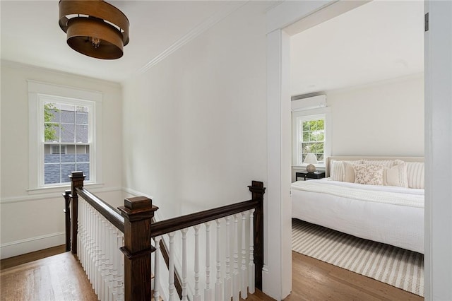 175 Freeman Pkwy, Providence, RI 02906 - corridor with an upstairs landing, wood finished floors, ornamental molding, and an AC wall unit