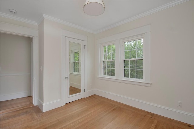 175 Freeman Pkwy, Providence, RI 02906 - spare room with a smoke detector, ornamental molding, and light wood-style floors