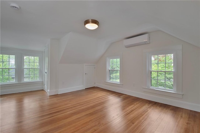 175 Freeman Pkwy, Providence, RI 02906 - bonus room featuring an AC wall unit, light wood-style floors, and vaulted ceiling