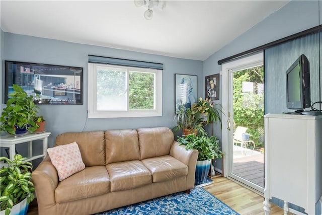 75 Crescent Ave, Cranston, RI 02910 - living area with vaulted ceiling and light wood-style flooring