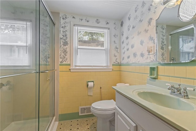 75 Crescent Ave, Cranston, RI 02910 - bathroom featuring wallpapered walls, vanity, a stall shower, tile patterned floors, and wainscoting