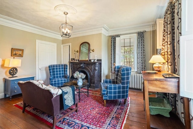 15 N Main St, Freetown, MA 02702 - sitting room with dark wood-type flooring, a chandelier, crown molding, and a fireplace