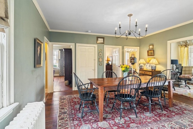 15 N Main St, Freetown, MA 02702 - dining area with radiator heating unit, a chandelier, hardwood / wood-style flooring, and ornamental molding