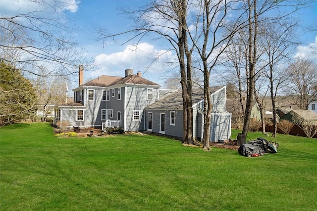 15 N Main St, Freetown, MA 02702 - back of property featuring a chimney and a yard