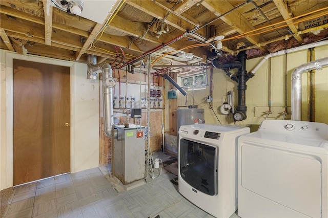 120 Landis Dr, Warwick, RI 02818 - washroom featuring washer and dryer, a heating unit, electric water heater, and tile patterned floors