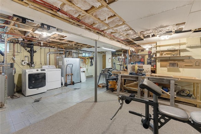 120 Landis Dr, Warwick, RI 02818 - unfinished below grade area with washing machine and clothes dryer, refrigerator, a workshop area, tile patterned floors, and water heater