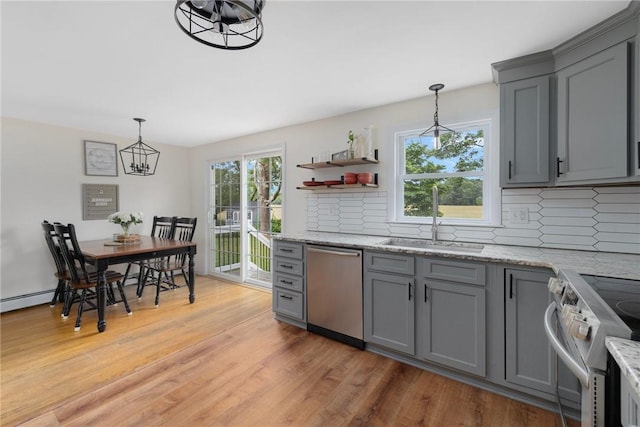 120 Landis Dr, Warwick, RI 02818 - kitchen featuring appliances with stainless steel finishes, gray cabinets, a chandelier, and tasteful backsplash