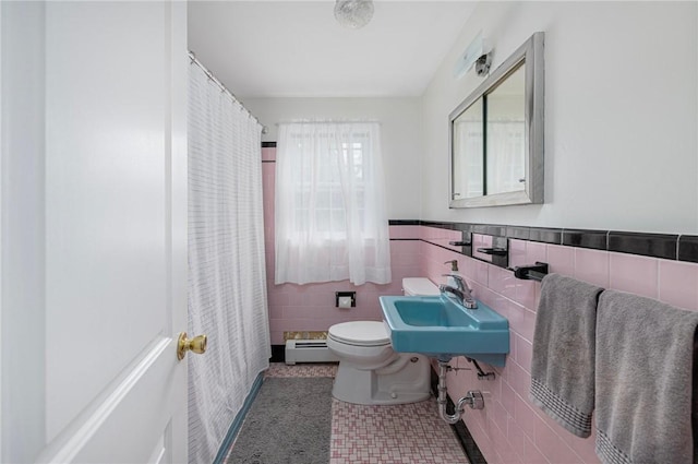 120 Landis Dr, Warwick, RI 02818 - bathroom featuring baseboard heating, tile walls, curtained shower, wainscoting, and tile patterned floors