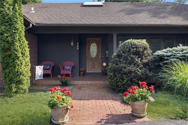 788 Namquid Dr, Warwick, RI 02888 - doorway to property featuring a shingled roof and a porch