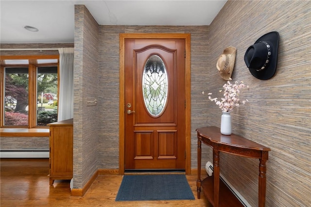 788 Namquid Dr, Warwick, RI 02888 - foyer featuring a baseboard radiator and wood finished floors