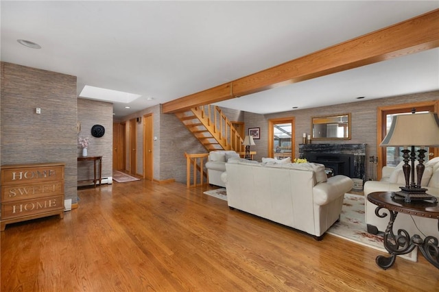 788 Namquid Dr, Warwick, RI 02888 - living area featuring a fireplace, stairway, and wood finished floors