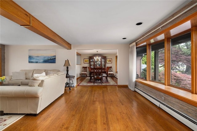 788 Namquid Dr, Warwick, RI 02888 - living room with baseboard heating, light wood-type flooring, a chandelier, and beam ceiling