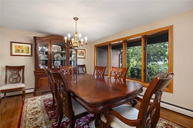 788 Namquid Dr, Warwick, RI 02888 - dining area with a baseboard heating unit, a chandelier, and light wood-style flooring