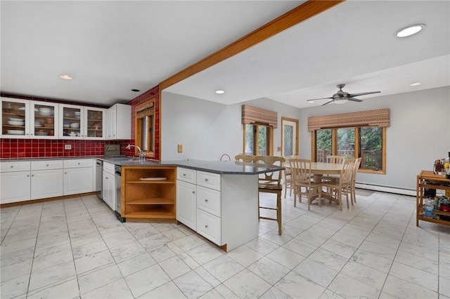 788 Namquid Dr, Warwick, RI 02888 - kitchen featuring open shelves, dark countertops, a baseboard radiator, white cabinets, and recessed lighting