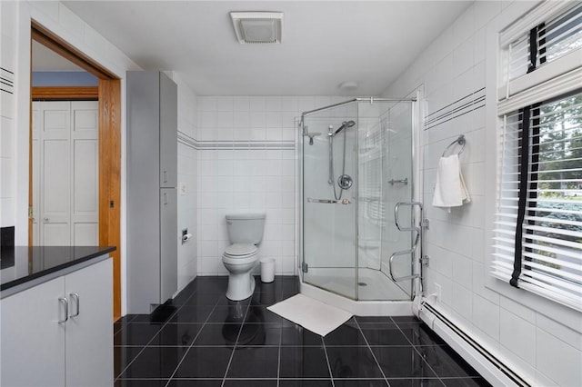 788 Namquid Dr, Warwick, RI 02888 - bathroom with tile walls, a baseboard radiator, tile patterned flooring, and a stall shower