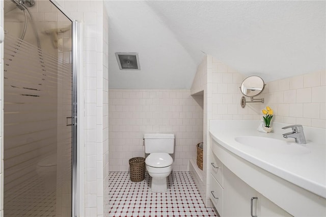 788 Namquid Dr, Warwick, RI 02888 - full bathroom with tile walls, vanity, lofted ceiling, a shower stall, and tile patterned flooring