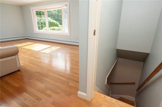 70 High Ridge Dr, Cumberland, RI 02864 - unfurnished living room featuring wood finished floors, crown molding, and a baseboard heating unit