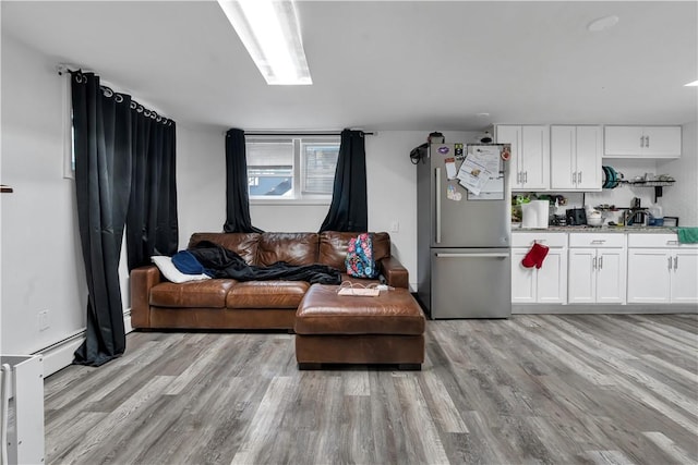 101 Benefit St, Pawtucket, RI 02860 - living room featuring light wood-type flooring and baseboard heating