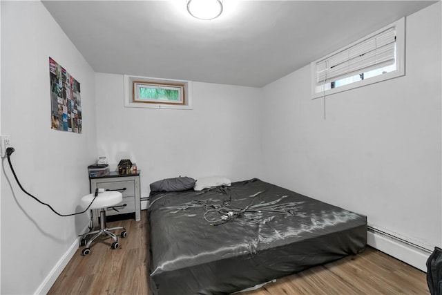 101 Benefit St, Pawtucket, RI 02860 - bedroom featuring a baseboard radiator and wood finished floors