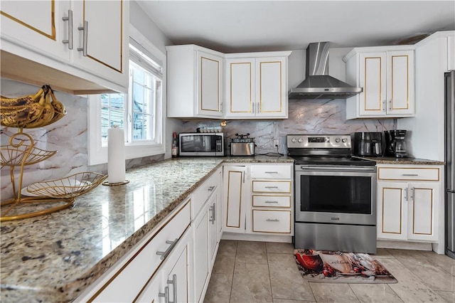 101 Benefit St, Pawtucket, RI 02860 - kitchen with wall chimney exhaust hood, appliances with stainless steel finishes, backsplash, white cabinetry, and light stone countertops