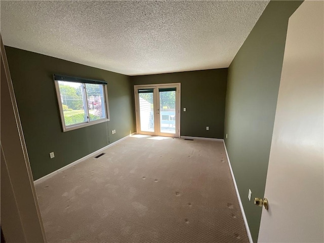 511 Child St Unit 101, Warren, RI 02885 - spare room featuring a textured ceiling and carpet flooring