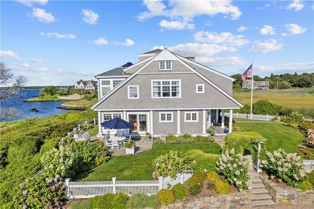 9 Arraquat Rd, Westerly, RI 02891 - back of property featuring a water view and a patio area