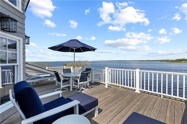 9 Arraquat Rd, Westerly, RI 02891 - wooden terrace with outdoor dining space and a water view