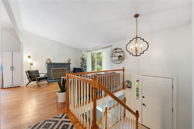 11 Burr Ave, Barrington, RI 02806 - entryway with a chandelier, lofted ceiling, and light wood finished floors