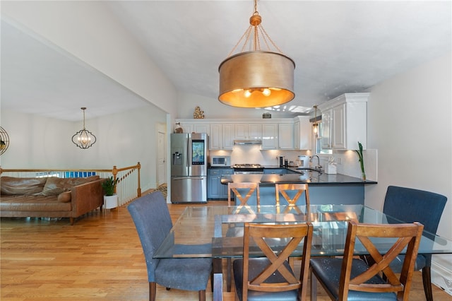 11 Burr Ave, Barrington, RI 02806 - dining room with a chandelier and light wood-style floors