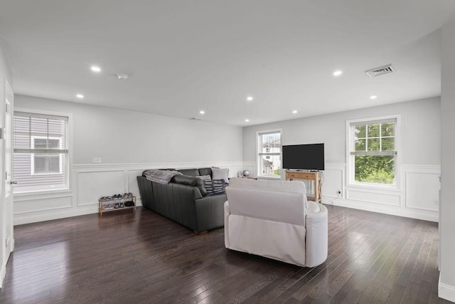 15 Spadina Ave, Warwick, RI 02889 - living area featuring wainscoting, dark wood finished floors, a decorative wall, and recessed lighting