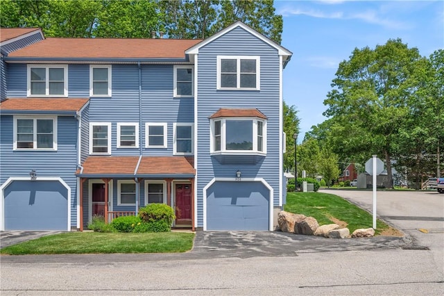 200 Heroux Blvd Unit 908, Cumberland, RI 02864 - multi unit property with an attached garage, asphalt driveway, and a front lawn