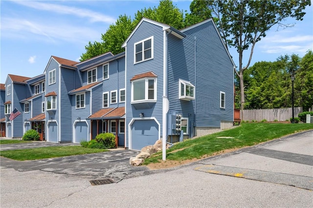 200 Heroux Blvd Unit 908, Cumberland, RI 02864 - view of front of home featuring asphalt driveway and a garage