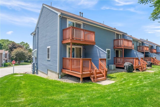 200 Heroux Blvd Unit 908, Cumberland, RI 02864 - back of house with a lawn and a wooden deck