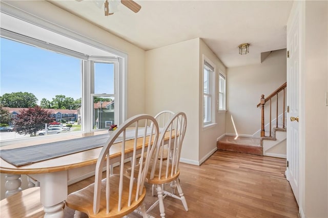 200 Heroux Blvd Unit 908, Cumberland, RI 02864 - dining room featuring light wood-style flooring, stairway, and ceiling fan