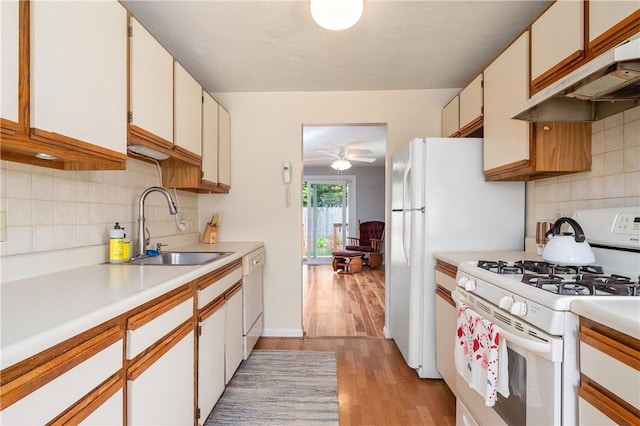 200 Heroux Blvd Unit 908, Cumberland, RI 02864 - kitchen featuring white appliances, light countertops, light wood-style flooring, backsplash, and a ceiling fan