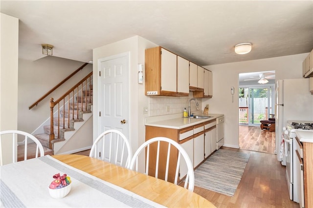 200 Heroux Blvd Unit 908, Cumberland, RI 02864 - kitchen with white appliances, light countertops, light wood-style flooring, decorative backsplash, and a ceiling fan