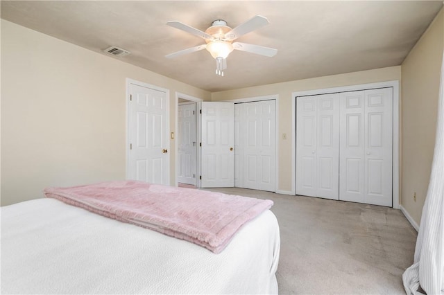 200 Heroux Blvd Unit 908, Cumberland, RI 02864 - bedroom with multiple closets, light carpet, and ceiling fan