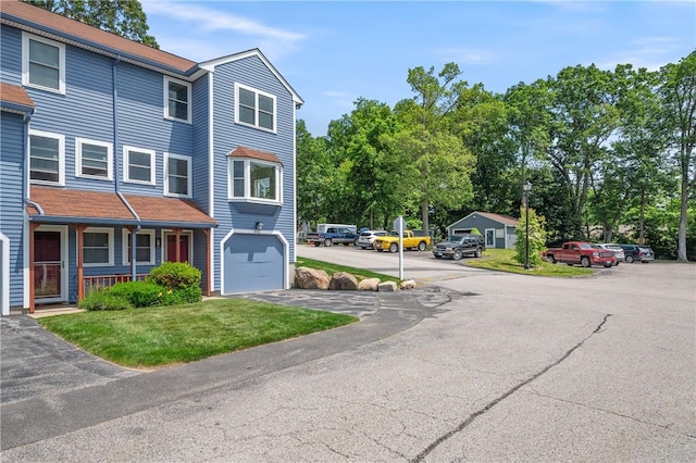 200 Heroux Blvd Unit 908, Cumberland, RI 02864 - view of front of property with driveway, an attached garage, and a front yard