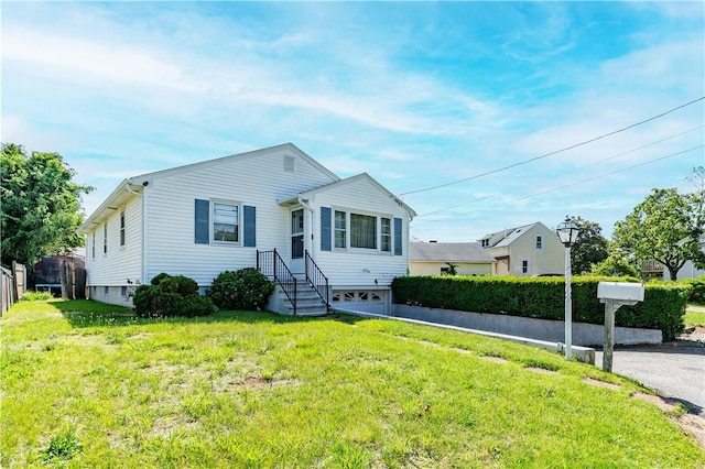 111 Belgium St, Cranston, RI 02920 - view of front facade with a front lawn and a garage